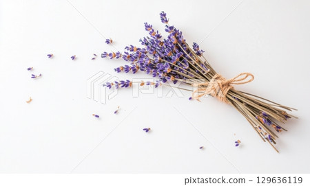 A bundle of dried lavender tied with twine on white background, perfect rustic botanical element for farmhouse decor, wellness products, or minimalist interiors. A bundle of dried lavender tied with twine on white background, perfect rustic botanical element for farmhouse decor, wellness products, or minimalist interiors. 129636119