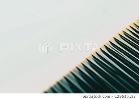 Close-up view of sharp, angled lines creating an abstract pattern on a clean surface 129636182