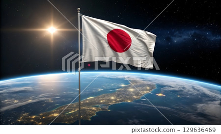 Japan flag waving above earth with city lights and sun in space background 129636469