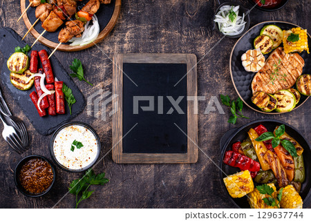 Assortment of grilled bbq meat and vegetables Assortment of grilled bbq meat and vegetables 129637744