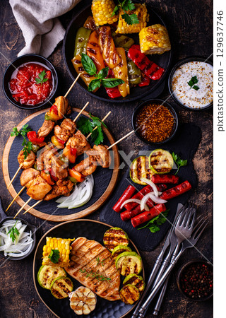 Assortment of grilled bbq meat and vegetables Assortment of grilled bbq meat and vegetables 129637746