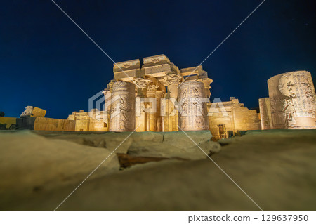 Illuminated Wall of the Temple of Kom Ombo in Egypt at Night. Illuminated Wall of the Temple of Kom Ombo in Egypt at Night. 129637950