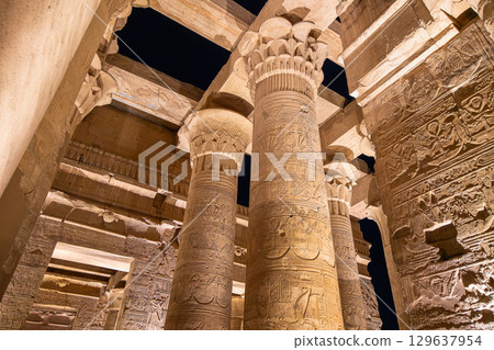 Illuminated Columns of the Temple of Kom Ombo at Night in Egypt. 129637954