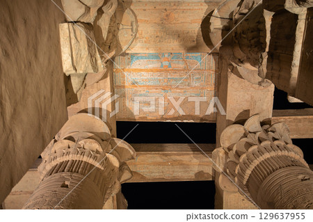 Illuminated Ceiling Details of Kom Ombo Temple in Egypt at Night. Illuminated Ceiling Details of Kom Ombo Temple in Egypt at Night. 129637955