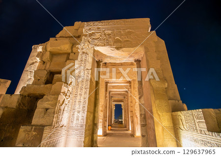 Temple of Kom Ombo facade illuminated at night with hieroglyphs. Temple of Kom Ombo facade illuminated at night with hieroglyphs. 129637965