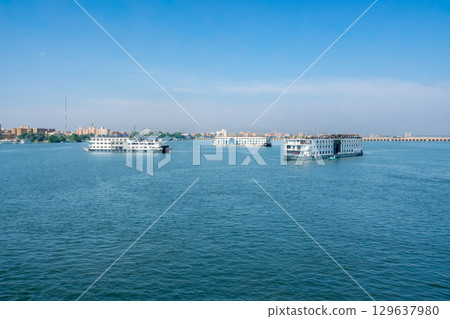 Beautiful blue sky with white clouds over Esna Lock Nile River Egypt. 129637980