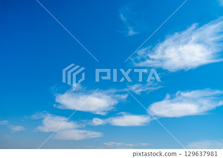 Bright Blue Sky with White Clouds over Esna Lock Nile Egypt. 129637981