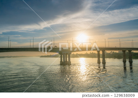 Sunset Over the Nile River Bridge in Luxor with Cityscape. Sunset Over the Nile River Bridge in Luxor with Cityscape. 129638009