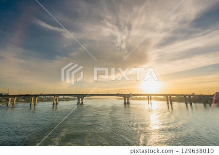 Sunset Bridge over Nile River near Temple of Luxor Egypt. Sunset Bridge over Nile River near Temple of Luxor Egypt. 129638010