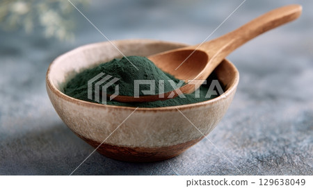 Healthy ingredient concept featuring spirulina powder for food branding and nutrition projects Healthy ingredient concept featuring spirulina powder for food branding and nutrition projects 129638049