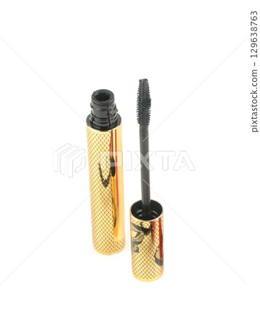 Cosmetic black mascara, volume brush isolated on white background. Cosmetic black mascara, volume brush isolated on white background. 129638763