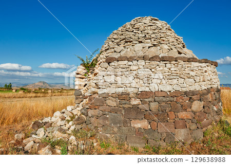 Prehistoric Nuraghe stone tower in Sardinian countryside 129638988