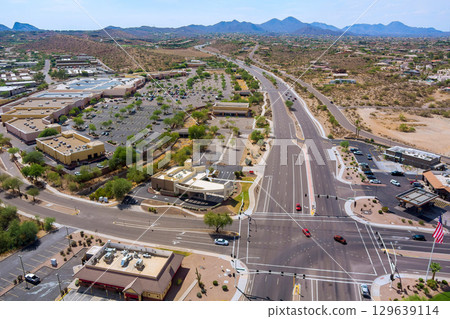 Aerial view of Fountain Hills, Arizona. Commercial district with roads mountain backdrop. 129639114