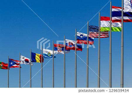 flags of countries against blue sky flags of countries against blue sky 129639434