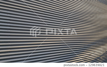 Corrugated Metal Wall Texture with Dynamic Shadows and Highlights 129639821