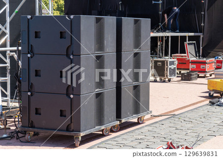 Professional concert acoustic systems set up on an open-air stage Professional concert acoustic systems set up on an open-air stage 129639831