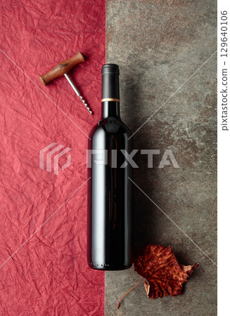 Bottle of red wine on vintage background. Bottle of red wine on vintage background. 129640106