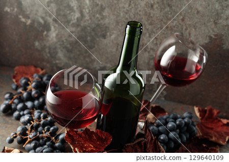 Red wine and blue grapes. Red wine and blue grapes. 129640109