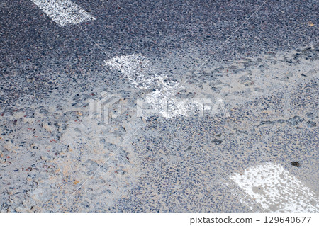 Abstract representation of road texture with white line markings Abstract representation of road texture with white line markings 129640677