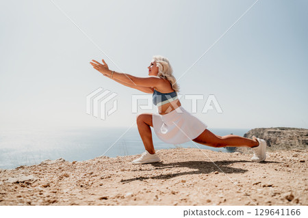 Woman in White Skirt Doing a Lunge Pose During Outdoor Workout Woman in White Skirt Doing a Lunge Pose During Outdoor Workout 129641166