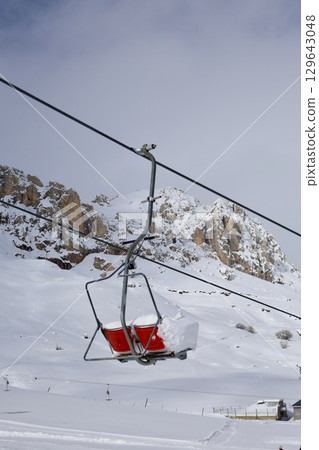 Snowy mountain ski-lift no people, blue sky, azure, air, freshness, ecology. High quality photo 129643048