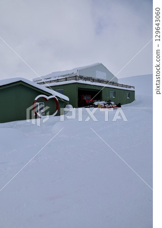 A building with snow on the ground. High quality photo 129643060