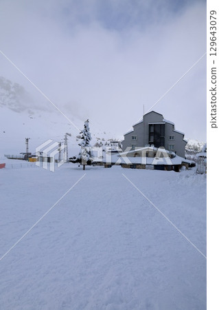 A building with snow on the ground. High quality photo A building with snow on the ground. High quality photo 129643079