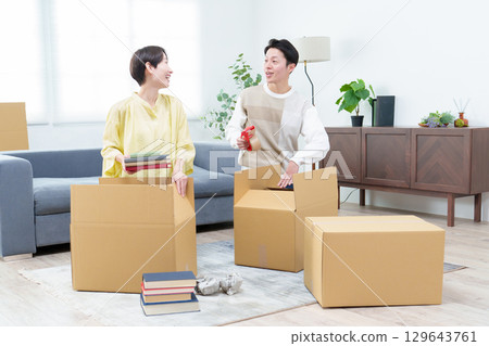A young couple preparing to move 129643761
