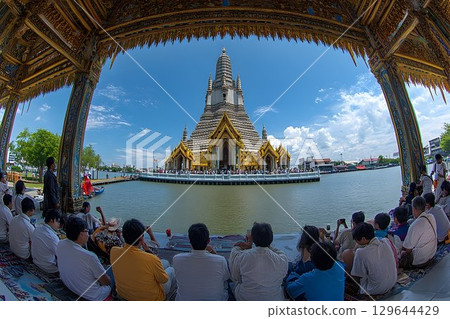 Wat Arun Temple View from Ornate Pavilion with People Gazing at 129644429