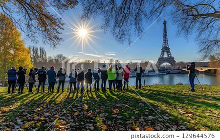 Eiffel Tower Photographers Gather on Autumnal Bank of Seine Rive Eiffel Tower Photographers Gather on Autumnal Bank of Seine Rive 129644576