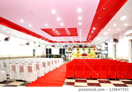 Wedding Hall Decorated for Reception Stage & Seating Arrangement 129647591