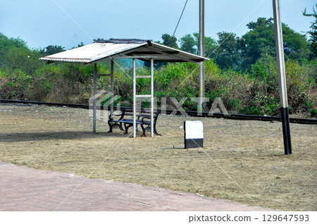 Small Rural Railway Platform with Bench and Shed in Countryside Small Rural Railway Platform with Bench and Shed in Countryside 129647593
