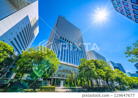 Tokyo cityscape in Japan. Intense heat...scorching sunlight...view of Chiyoda Ward Office and other buildings. Towards a new era = August 15th 129647677