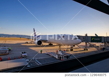 Thai airways aircraft at departure terminal of Kansai Airport, Osaka 129648075