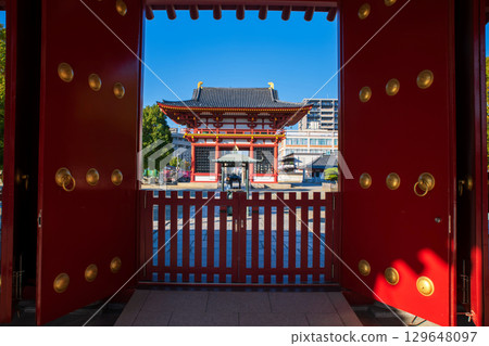 Shitennoji Temple Sanmon gate view from red gate at autumn, Osaka Shitennoji Temple Sanmon gate view from red gate at autumn, Osaka 129648097