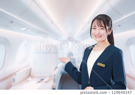 A woman working as a flight attendant on a private jet 129648347