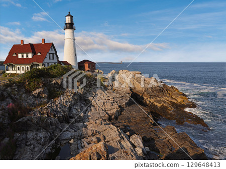 Portland Head Light in late afternoon surrounded by with dramatic waves and cliffs, Maine, USA Portland Head Light in late afternoon surrounded by with dramatic waves and cliffs, Maine, USA 129648413