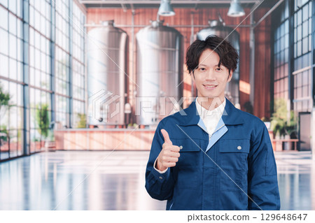 A man working at a brewery 129648647