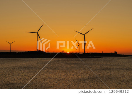 Wind turbines shining in the morning sun Wind turbines shining in the morning sun 129649212