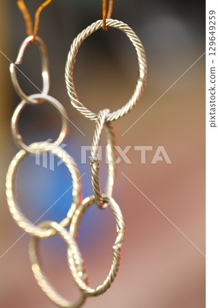Metal Rings Hanging in a shop 129649259