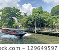 Thailand tourist canal boat on village river at daytime 129649597