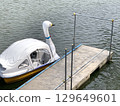 Retro white duck recreation boat and park pier on the lake in Japan 129649601