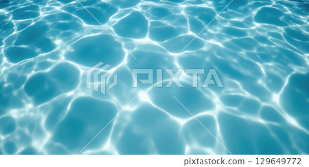 Swimming Pool Water Surface Looking down at the surface of a clear, blue swimming pool. Gentle ripples and patterns are 129649772