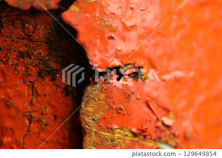 Orange color Paint on Old Metal 129649854