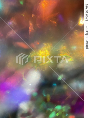 Colorful fantastic glass gems glitter light crystal texture jewelry background Colorful fantastic glass gems glitter light crystal texture jewelry background 129650765