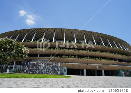 The National Stadium shines against the blue sky. July Shinjuku 416 National Stadium The National Stadium shines against the blue sky. July Shinjuku 416 National Stadium 129651838
