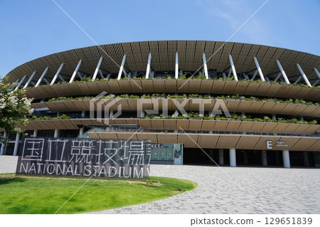 The National Stadium shines against the blue sky. July Shinjuku 417 National Stadium The National Stadium shines against the blue sky. July Shinjuku 417 National Stadium 129651839