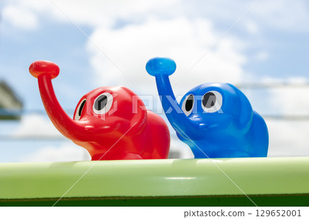 Blue sky and elephant watering can Blue sky and elephant watering can 129652001