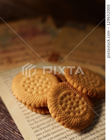 Biscuits and cards on the table 129652008