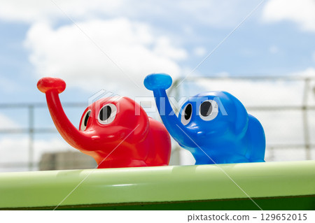 Blue sky and elephant watering can Blue sky and elephant watering can 129652015